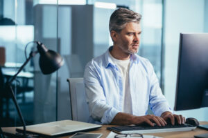 A professional business man working hard at his desk.